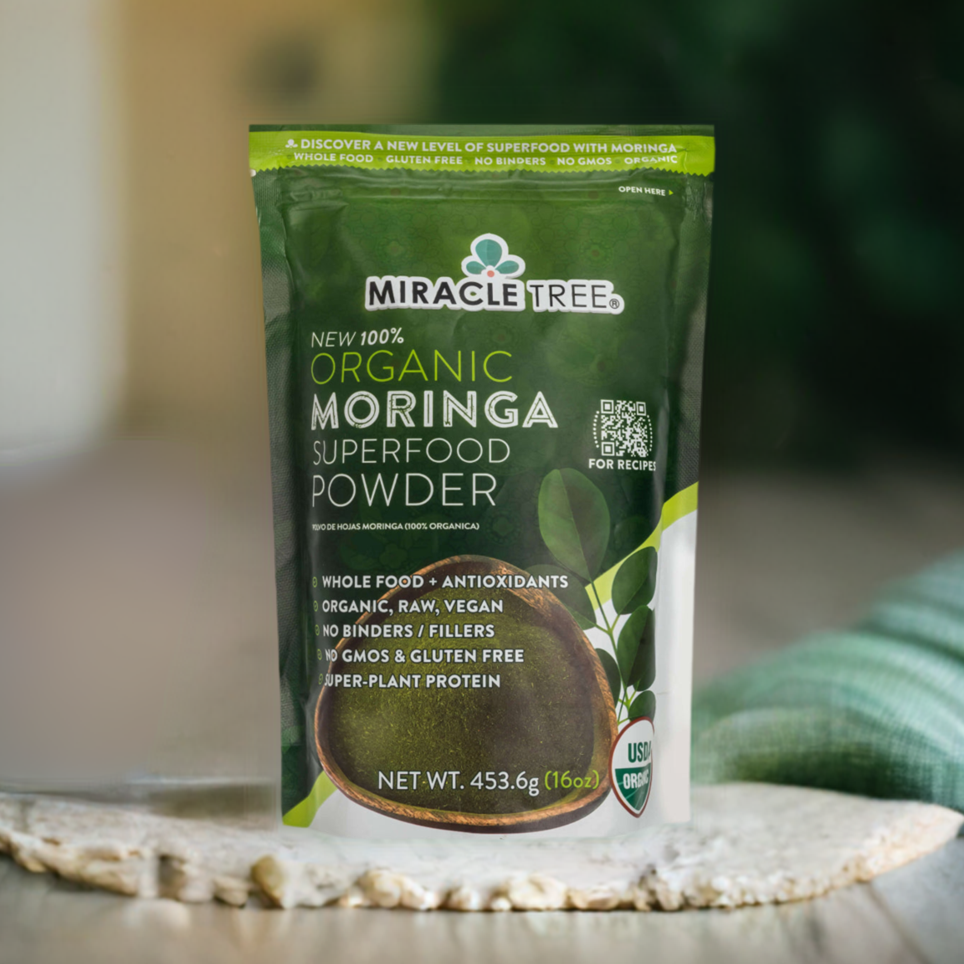 
                  
                    A green and white pouch of Miracle Tree 100% Organic Moringa is displayed upright, featuring whole food, antioxidant-rich, organic, and non-GMO qualities. Weighing 453.6g (16oz), it captures the essence of a superfood.
                  
                